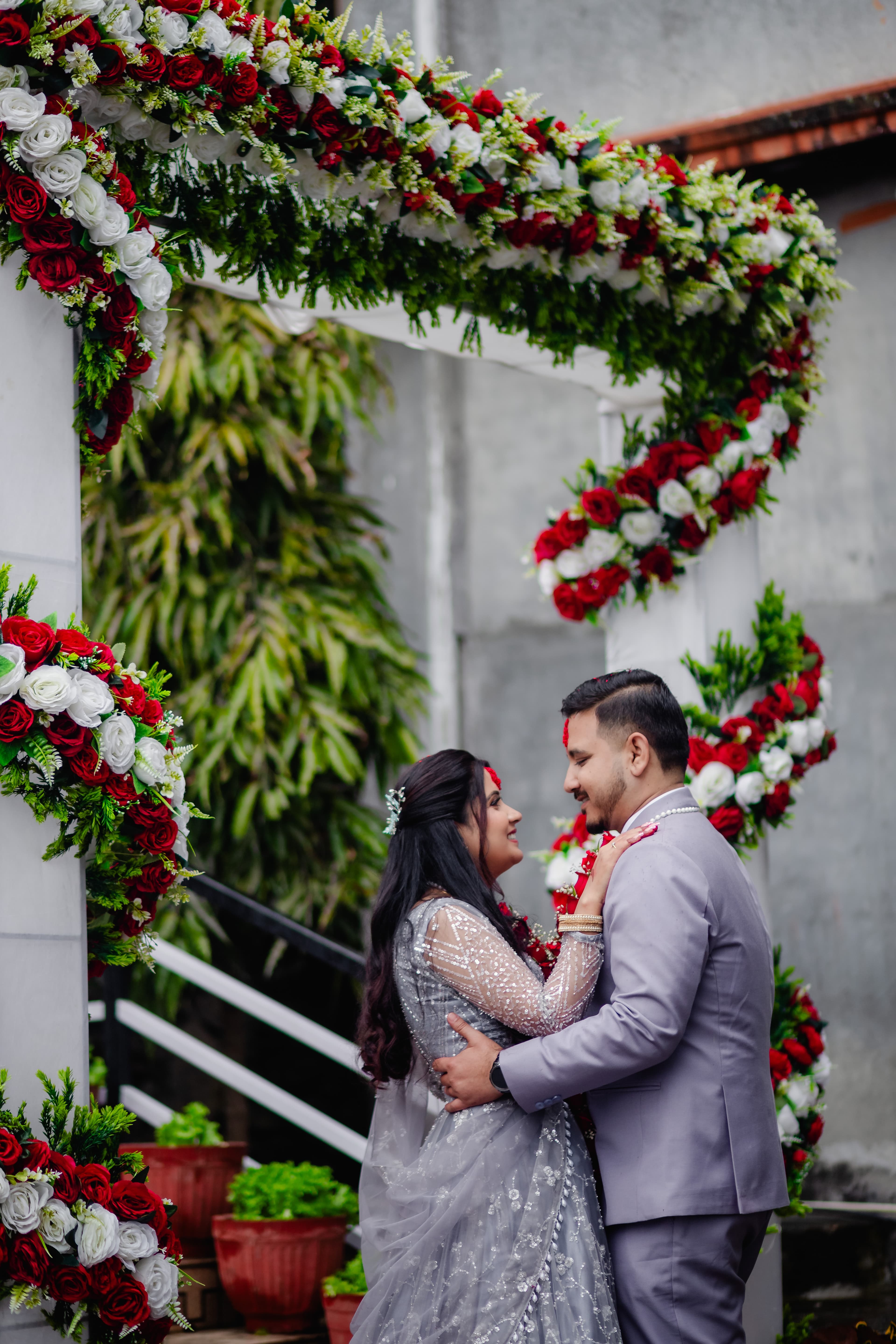 Engagement Couple under Floral Arch