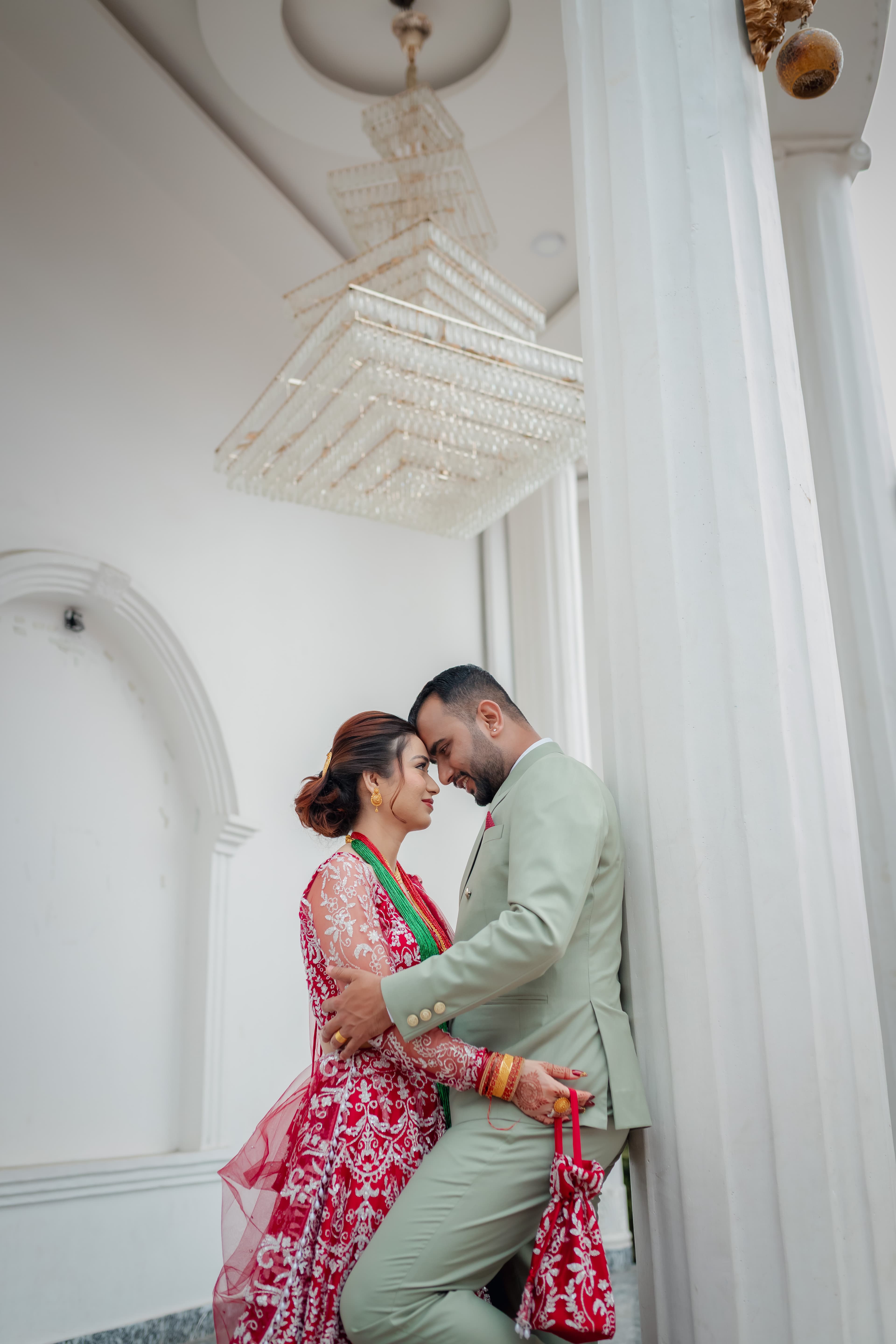 Couple Embrace by White Columns