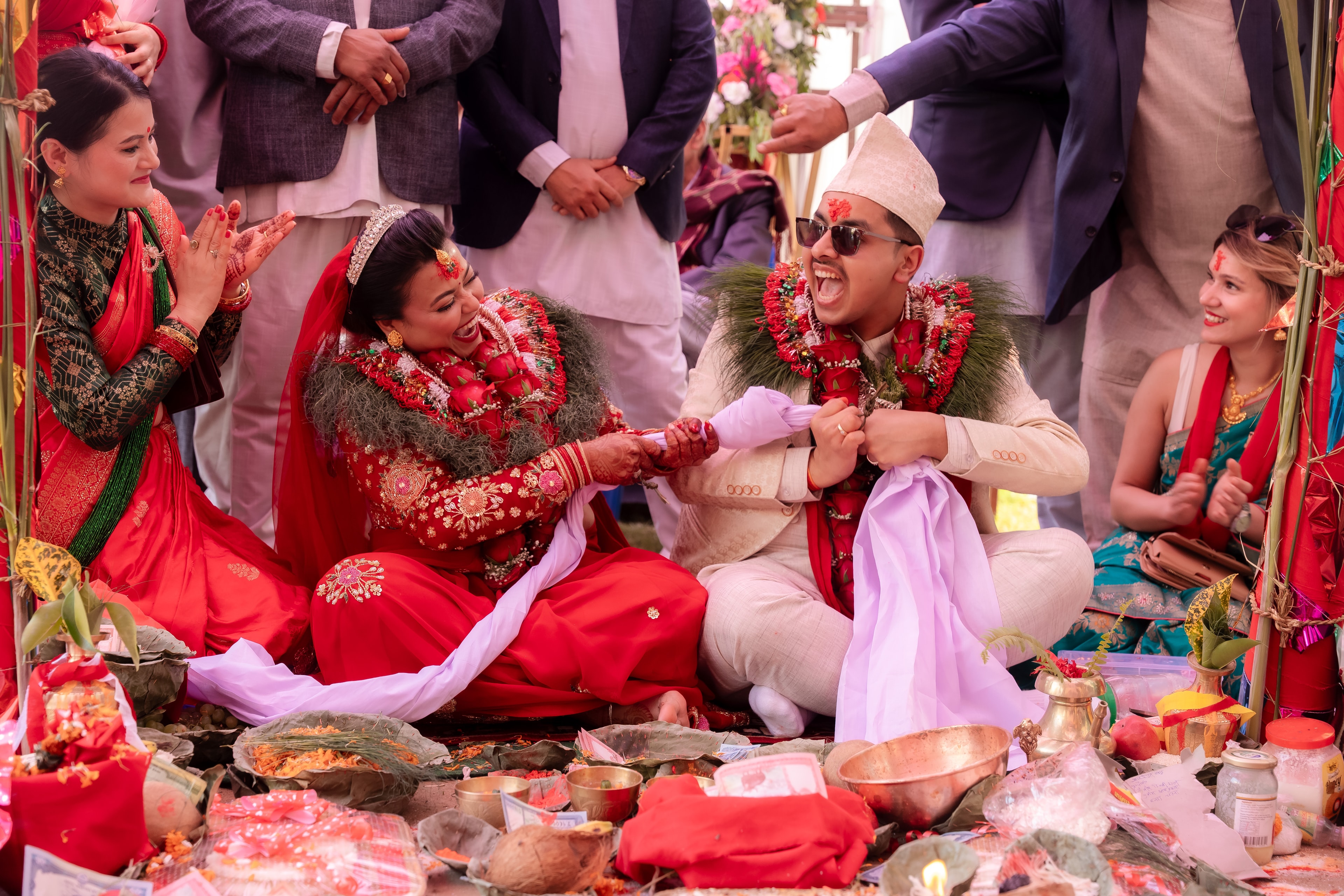 Wedding couple laughing together during ceremony rituals, Pokhara Nepal